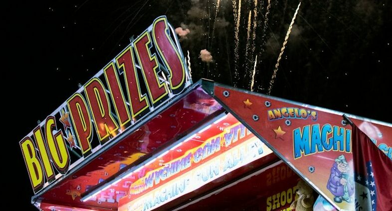 photograph of fireworks over shooting booth